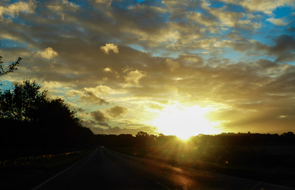 A Norfolk sunset through the  car windscreen.