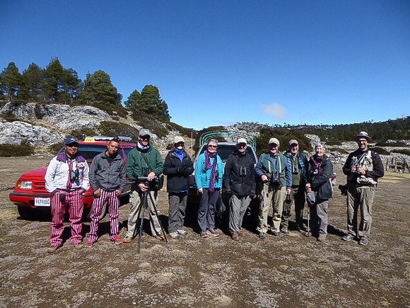 Our cheery group ( and drivers  in stripey  trousers!)  at altitude.
