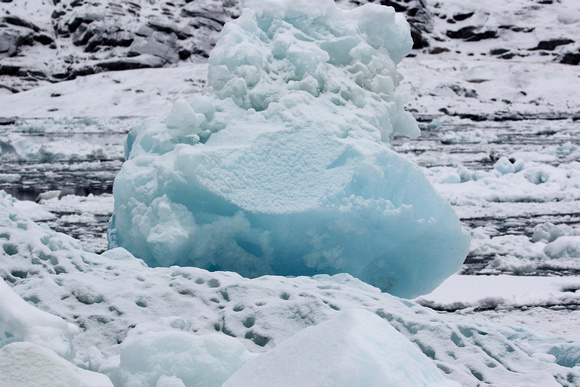 Glacial ice...blue  because  compression  removes  all the air  bubbles  from it.
