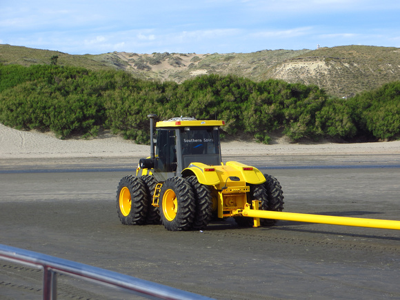 ...to be pulled  up the beach by a  Real Man's Tractor!!