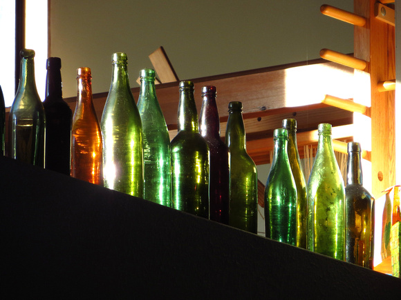 Old bottles  found  buried in the garden, catching the morning sun.