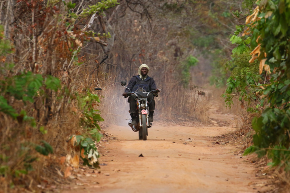 A typical African scene...note the  hoodie for a  helmet !